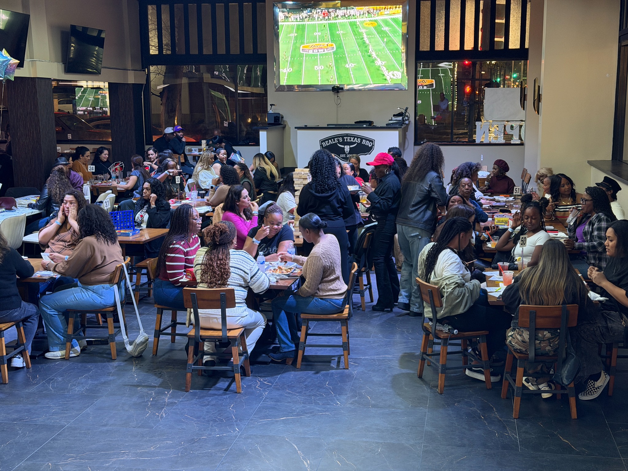 Guests playing Rhythm and Bingo together at packed tables