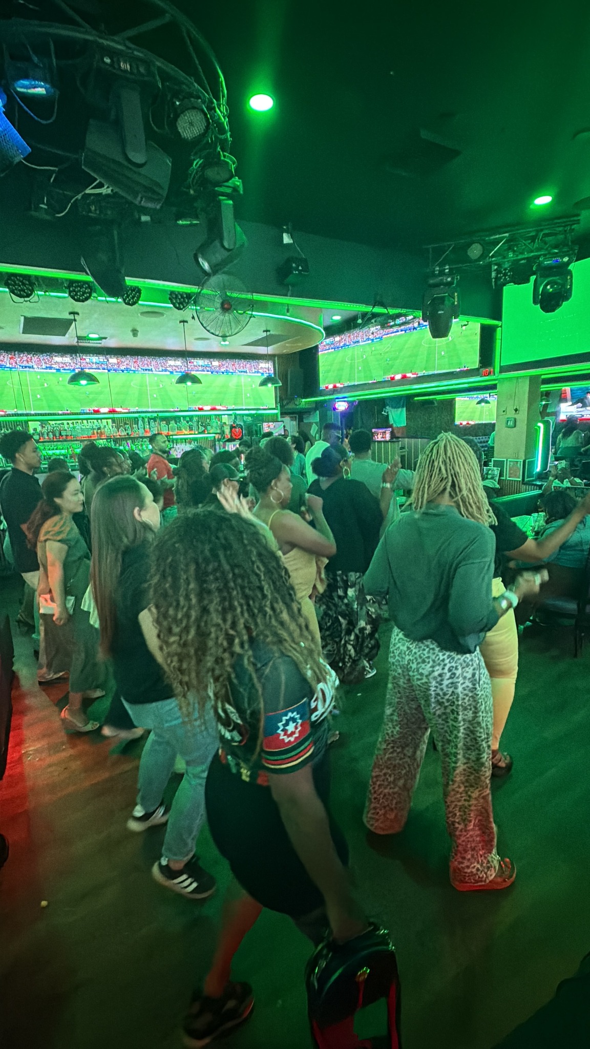 A lively Rhythm and Bingo crowd dancing